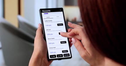 woman looking at her rewards with a reward program