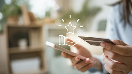 ustomer using smartphone and card with reward icon, representing redeem points, loyalty rewards, cashback offers, digital vouchers and mobile payment