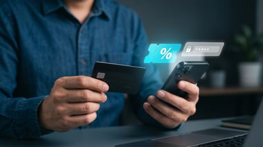 Person holding a credit card and smartphone with a digital promo code and discount voucher icon for online shopping.