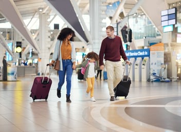 family on vacation at the airport