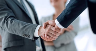b2b business men handshake