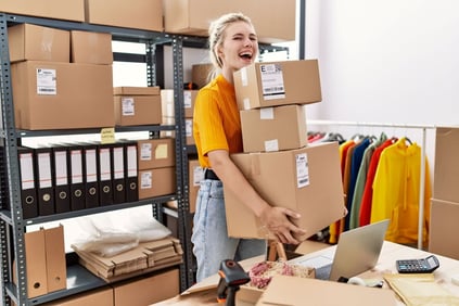 woman holds a lot of packages for shipping ecommerce